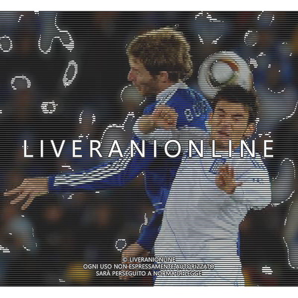 (100623) -- POLOKWANE, June 23, 2010 () -- Avraam Papadopoulos of Greece (R) vies with Mario Bolatti of Argentina during their 2010 World Cup Group B soccer match in Polokwane, South Africa, June 22, 2010. Argentina won 2-0 and qualifies for the next round. (/Wang Yuguo)(fym) ©Photoshot/Agenzia Aldo Liverani Sas - ITALY ONLY: ARGENTINA - GRECIA FIFA WORLD CUP CAMPIONATI MONDIALI SUD AFRICA 2010