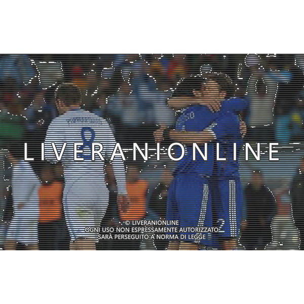 (100623) -- POLOKWANE, June 23, 2010 () -- Greece\'s Avraam Papadopoulos (L) walks past Argentina players celebrating their victory after the 2010 World Cup Group B soccer match in Polokwane, South Africa, June 22, 2010. Argentina won 2-0 and qualifies for the next round.(/Xu Suhui)(fym) ©Photoshot/Agenzia Aldo Liverani Sas - ITALY ONLY: ARGENTINA - GRECIA FIFA WORLD CUP CAMPIONATI MONDIALI SUD AFRICA 2010