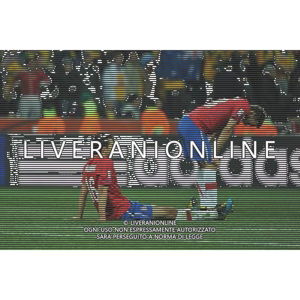 (100624) -- NELSPRUIT, June 24, 2010 () -- Serbia\'s Ivan Obradovic (L) and Milos Ninkovic react after the 2010 World Cup Group D match against Australia in Nelspruit, South Africa, June 23, 2010. Serbia lost to Australia 1-2. Both Serbia and Australia are disqualified for the round of 16. (/Xu Suhui) ©Photoshot/Agenzia Aldo Liverani Sas - ITALY ONLY: AUSTRALIA - SERBIA FIFA WORLD CUP CAMPIONATI MONDIALI SUD AFRICA 2010
