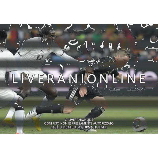 (100624) -- JOHANNESBURG, June 24, 2010 () -- Germany\'s Bastian Schweinsteiger (R) vies with Ghana\'s Prince Tagoe during the 2010 World Cup Group D match in Johannesburg, South Africa, June 23, 2010. Germany won the match 1-0. Both Germany and Ghana are qualified for the round of 16. (/Li Ga) ©Photoshot/Agenzia Aldo Liverani Sas - ITALY ONLY: GERMANIA - GHANA FIFA WORLD CUP CAMPIONATI MONDIALI SUD AFRICA 2010