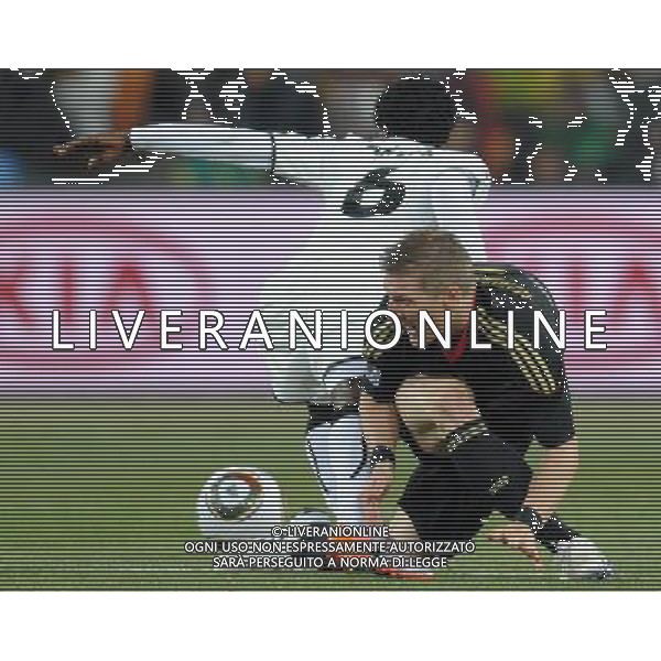 (100624) -- JOHANNESBURG, June 24, 2010 () -- Germany\'s Bastian Schweinsteiger (R) vies with Ghana\'s Anthony Annan during the 2010 World Cup Group D match in Johannesburg, South Africa, June 23, 2010. Germany won the match 1-0. Both Germany and Ghana are qualified for the round of 16. (/Li Ga) ©Photoshot/Agenzia Aldo Liverani Sas - ITALY ONLY: GERMANIA - GHANA FIFA WORLD CUP CAMPIONATI MONDIALI SUD AFRICA 2010