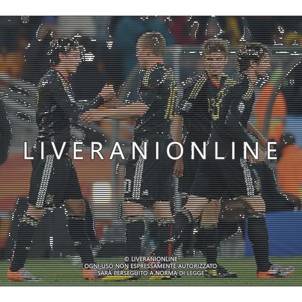 (100624) -- JOHANNESBURG, June 24, 2010 () -- Germany\'s Mesut Oezil (L) celebrates his goal with teammate Lukas Podolski (L2) during the 2010 World Cup Group D match against Ghana in Johannesburg, South Africa, June 23, 2010. Both Germany and Ghana are qualified for the round of 16. (/Li Ga) ©Photoshot/Agenzia Aldo Liverani Sas - ITALY ONLY: GERMANIA - GHANA FIFA WORLD CUP CAMPIONATI MONDIALI SUD AFRICA 2010