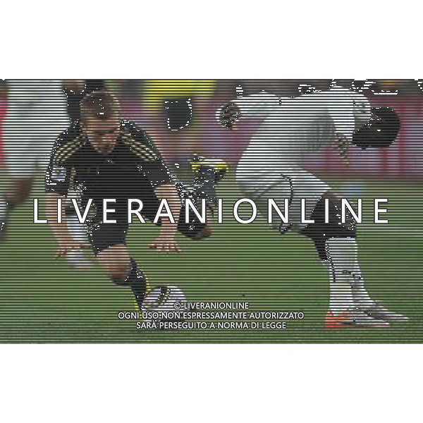 (100624) -- JOHANNESBURG, June 24, 2010 () -- Germany\'s Lukas Podolski (L) falls over during the 2010 World Cup Group D match against Ghana in Johannesburg, South Africa, June 23, 2010. Germany won the match 1-0. Both Germany and Ghana are qualified for the round of 16. (/Li Ga) ©Photoshot/Agenzia Aldo Liverani Sas - ITALY ONLY: GERMANIA - GHANA FIFA WORLD CUP CAMPIONATI MONDIALI SUD AFRICA 2010