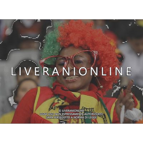 (100625) -- CAPE TOWN, June 25, 2010 -- A Cameroonian supporter cheers prior to the Group E last round match between Netherlands and Cameroon at 2010 FIFA World Cup at Green Point stadium in Cape Town, South Africa, on June 24, 2010. Xing Guangli) (xm) ©Photoshot/Agenzia Aldo Liverani Sas - ITALY ONLY: OLANDA - CAMERUN FIFA WORLD CUP CAMPIONATI MONDIALI SUD AFRICA 2010