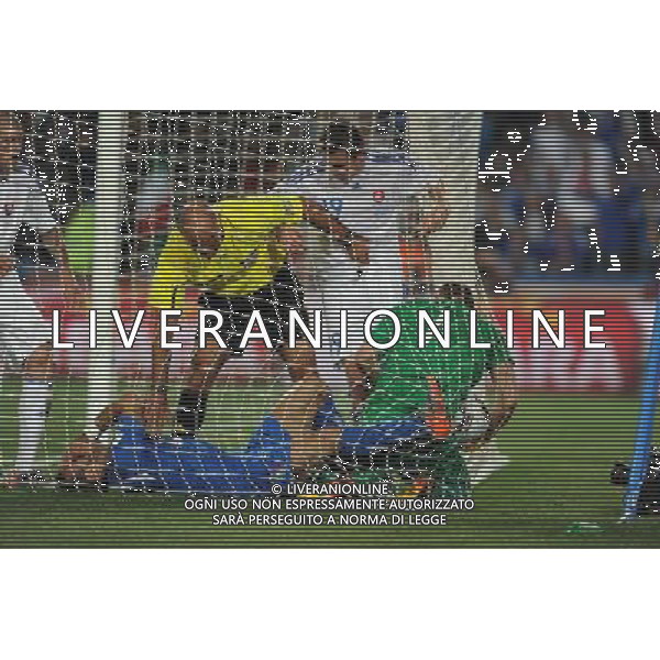 (100624) -- JOHANNESBURG, June 24, 2010 -- Italy\'s Fabio Quagliarella (Bottom L) is conflicted with Slovakia\'s goalkeeper RJan Mucha (R) during the 2010 World Cup Group F soccer match at Ellis Park stadium in Johannesburg, South Africa, June 24, 2010. Slovakia won 3-2. Guo Yong) (kh) ©Photoshot/Agenzia Aldo Liverani Sas - ITALY ONLY: SLOVACCHIA - ITALIA FIFA WORLD CUP CAMPIONATI MONDIALI SUD AFRICA 2010
