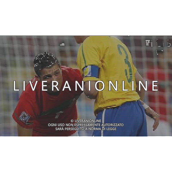 (100625) -- DURBAN, June 25, 2010 -- Brazil\'s Lucio (R) helps Portugal\'s Cristiano Ronaldo during the Group G last round match at 2010 FIFA World Cup, at Moses Mabhida stadium in Durban, South Africa, on June 25, 2010. Liao Yujie) (dl) MONDIALI DI CALCIO SUDAFRICA 2010 PORTOGALLO BRASILE CALCIO SPORT ©PHOTOSHOT/ALDO LIVERANI ITALY ONLY