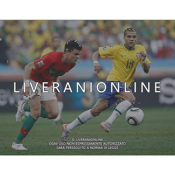 (100625) -- DURBAN, June 25, 2010 -- Brazil\'s Dani Alves (R) vies with Pepe of Portugal during the Group G last round match at 2010 FIFA World Cup, at Moses Mabhida stadium in Durban, South Africa, on June 25, 2010. Liao Yujie) (dl) MONDIALI DI CALCIO SUDAFRICA 2010 PORTOGALLO BRASILE CALCIO SPORT ©PHOTOSHOT/ALDO LIVERANI ITALY ONLY