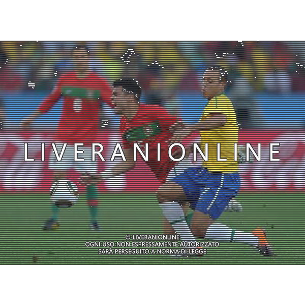 (100625) -- DURBAN, June 25, 2010 -- Brazil\'s Luis Fabiano (R) vies with Pepe of Portugal during the Group G last round match at 2010 FIFA World Cup, at Moses Mabhida stadium in Durban, South Africa, on June 25, 2010. Chen Haitong) (dl) MONDIALI DI CALCIO SUDAFRICA 2010 PORTOGALLO BRASILE CALCIO SPORT ©PHOTOSHOT/ALDO LIVERANI ITALY ONLY