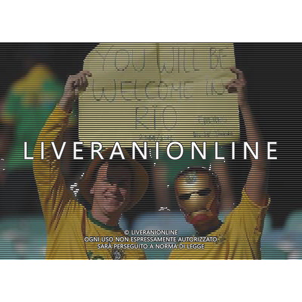(100625) -- DURBAN, June 25, 2010 -- Two fans of Brazil cheer prior to the Group G last round match between Portugal and Brazil at 2010 FIFA World Cup, at Moses Mabhida stadium in Durban, South Africa, on June 25, 2010. Chen Haitong) (dl) MONDIALI DI CALCIO SUDAFRICA 2010 PORTOGALLO BRASILE CALCIO SPORT ©PHOTOSHOT/ALDO LIVERANI ITALY ONLY