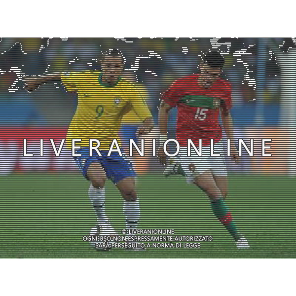 (100626) -- DURBAN, June 26, 2010 -- Brazil\'s Luis Fabiano (L) vies with Pepe of Portugal during the Group G last round match at 2010 FIFA World Cup, at Moses Mabhida stadium in Durban, South Africa, on June 25, 2010. The match tied 0-0. Both Brazil and Portugal are qualified for the round of 16. Chen Haitong) (dl) MONDIALI DI CALCIO SUDAFRICA 2010 PORTOGALLO BRASILE CALCIO SPORT ©PHOTOSHOT/ALDO LIVERANI ITALY ONLY