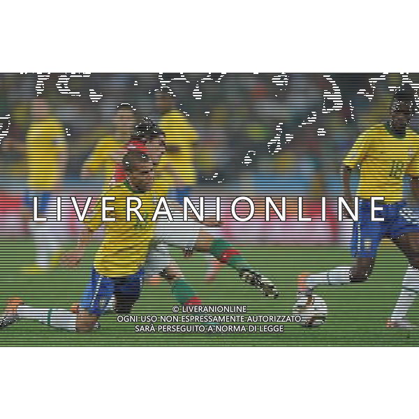 (100626) -- DURBAN, June 26, 2010 -- Brazil\'s Dani Alves falls on the pitch during the Group G last round match against Portugal at 2010 FIFA World Cup, at Moses Mabhida stadium in Durban, South Africa, on June 25, 2010. The match tied 0-0. Both Brazil and Portugal are qualified for the round of 16. Chen Haitong) (dl) MONDIALI DI CALCIO SUDAFRICA 2010 PORTOGALLO BRASILE CALCIO SPORT ©PHOTOSHOT/ALDO LIVERANI ITALY ONLY