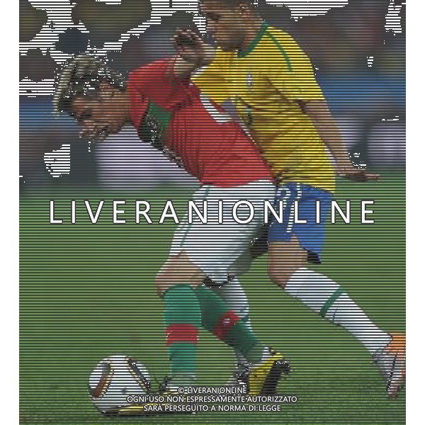 (100626) -- DURBAN, June 26, 2010 -- Brazil\'s Dani Alves (R) vies with Fabio Coentrao of Portugal during the Group G last round match at 2010 FIFA World Cup, at Moses Mabhida stadium in Durban, South Africa, on June 25, 2010. The match tied 0-0. Both Brazil and Portugal are qualified for the round of 16. Chen Haitong) (dl) MONDIALI DI CALCIO SUDAFRICA 2010 PORTOGALLO BRASILE CALCIO SPORT ©PHOTOSHOT/ALDO LIVERANI ITALY ONLY