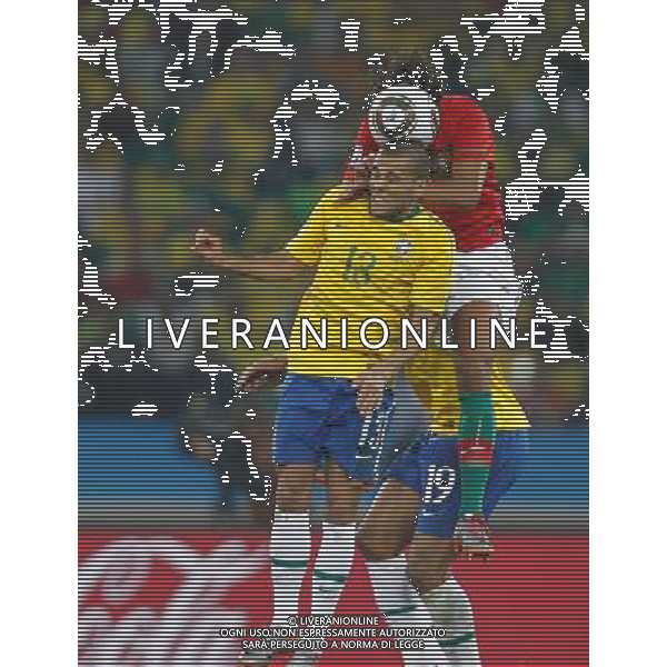 (100626) -- DURBAN, June 26, 2010 -- Brazil\'s Dani Alves (front) heads the ball during the Group G last round match against Portugal at 2010 FIFA World Cup, at Moses Mabhida stadium in Durban, South Africa, on June 25, 2010. The match tied 0-0. Both Brazil and Portugal are qualified for the round of 16. Liao Yujie) (dl) MONDIALI DI CALCIO SUDAFRICA 2010 PORTOGALLO BRASILE CALCIO SPORT ©PHOTOSHOT/ALDO LIVERANI ITALY ONLY