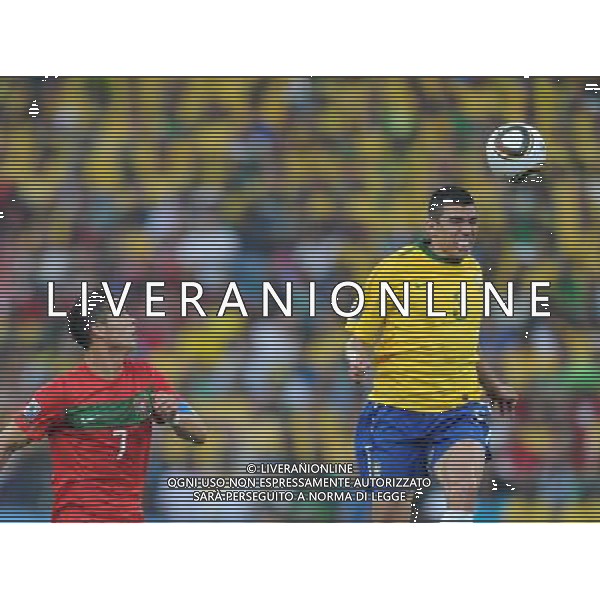 (100625) -- DURBAN, June 25, 2010 -- Brazil\'s Lucio (R) heads the ball during the Group G last round match against Portugal at 2010 FIFA World Cup, at Moses Mabhida stadium in Durban, South Africa, on June 25, 2010. The match tied 0-0. Both Brazil and Portugal are qualified for the round of 16. Chen Haitong) (dl) MONDIALI DI CALCIO SUDAFRICA 2010 PORTOGALLO BRASILE CALCIO SPORT ©PHOTOSHOT/ALDO LIVERANI ITALY ONLY