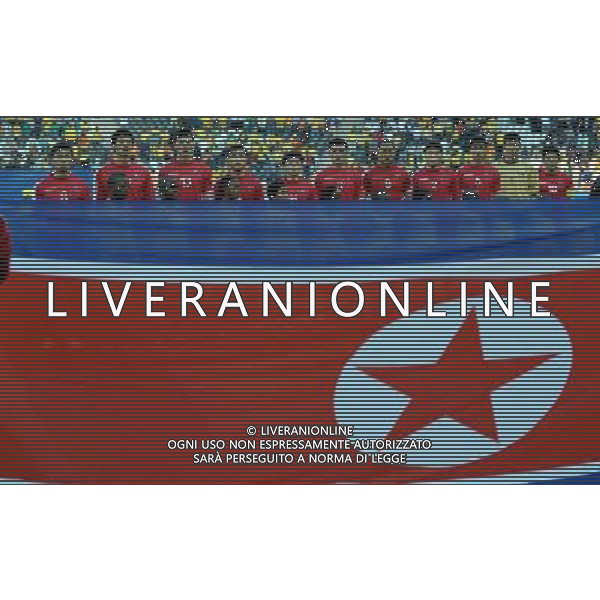 (100626) -- NELSPRUIT, June 26, 2010 -- Players of Democratic People\'s Republic of Korea (DPRK) listen to the national anthem before the Group G last round match against Cote d\'Ivoire at 2010 FIFA World Cup, at Mbombela Stadium in Nelspruit, South Africa, on June 25, 2010. Cote d\'Ivoire won 3-0 and both teams failed to progress to the next round. Wang Yuguo)(fym) COSTA D\'AVORIO COREA DEL NORD FIFA WORLD CUP 2010 SUDAFRICA CALCIO SPORT ©PHOTOSHOT/ALDO LIVERANI ITALY ONLY