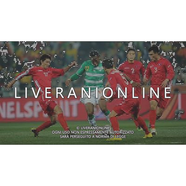 (100625) -- NELSPRUIT, June 25, 2010 -- Didier Drogba (2nd L) of Cote d\'Ivoire breaks through during the Group G last round match against Democratic People\'s Republic of Korea (DPRK) at 2010 FIFA World Cup, at Mbombela Stadium in Nelspruit, South Africa, on June 25, 2010. Cote d\'Ivoire won 3-0 and both teams failed to progress to the next round. Wang Yuguo)(fym) COSTA D\'AVORIO COREA DEL NORD FIFA WORLD CUP 2010 SUDAFRICA CALCIO SPORT ©PHOTOSHOT/ALDO LIVERANI ITALY ONLY