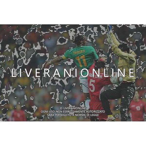 (100626) -- NELSPRUIT, June 26, 2010 -- Didier Drogba (Top L) of Cote d\'Ivoire heads the ball to shoot during the Group G last round match against Democratic People\'s Republic of Korea (DPRK) at 2010 FIFA World Cup, at Mbombela Stadium in Nelspruit, South Africa, on June 25, 2010. Cote d\'Ivoire won 3-0 and both teams failed to progress to the next round. Wang Yuguo)(fym) COSTA D\'AVORIO COREA DEL NORD FIFA WORLD CUP 2010 SUDAFRICA CALCIO SPORT ©PHOTOSHOT/ALDO LIVERANI ITALY ONLY