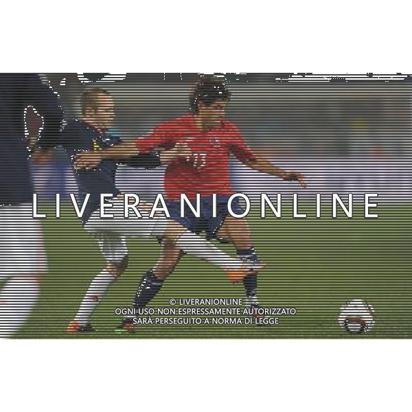 (100626) -- TSHWANE, June 26, 2010 -- CILE-SPAGNA NELLA FOTO Marco Estrada (R) of Chile vies with Andres Iniesta of Spain during the Group H last round match at 2010 FIFA World Cup, at Loftus Verfeld stadium in Tshwane, South Africa, on June 25, 2010. Spain won 2-1 and both teams are qualified for the next round. Li Ga) (fym) PHOTOSHOT-AG ALDO LIVERANI ONLY ITALY