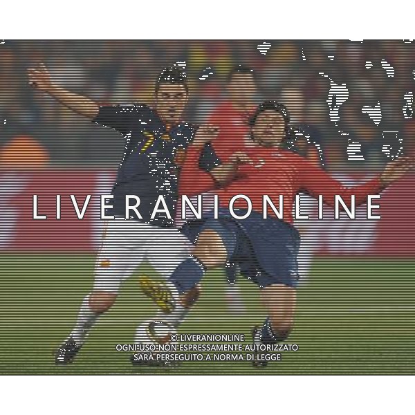 (100626) -- TSHWANE, June 26, 2010 -- David Villa (L) of Spain vies with a player of Chile during the Group H last round match at 2010 FIFA World Cup, at Loftus Verfeld stadium in Tshwane, South Africa, on June 25, 2010. Spain won 2-1 and both teams are qualified for the next round. Li Ga) (fym) PHOTOSHOT-AG ALDO LIVERANI ONLY ITALY