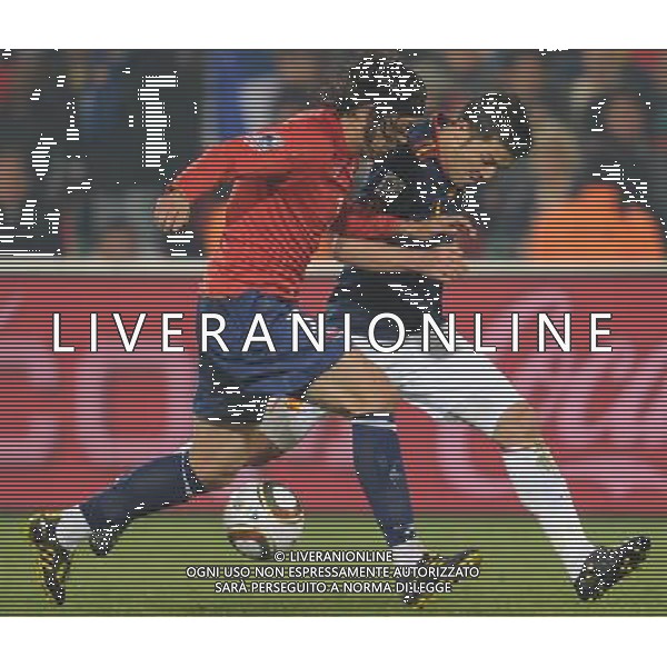 (100626) -- TSHWANE, June 26, 2010 -- David Villa (R) of Spain vies with a player of Chile during the Group H last round match at 2010 FIFA World Cup, at Loftus Verfeld stadium in Tshwane, South Africa, on June 25, 2010. Spain won 2-1 and both teams are qualified for the next round. Li Ga) (fym) PHOTOSHOT-AG ALDO LIVERANI ONLY ITALY