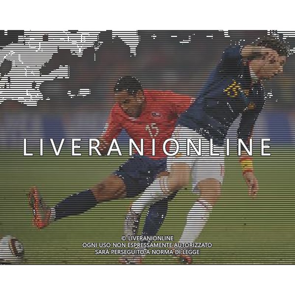 (100626) -- TSHWANE, June 26, 2010 -- Jean Beausejour (L) of Chile vies with Sergio Ramos of Spain during the Group H last round match at 2010 FIFA World Cup, at Loftus Verfeld stadium in Tshwane, South Africa, on June 25, 2010. Spain won 2-1 and both teams are qualified for the next round. Li Ga) (fym) PHOTOSHOT-AG ALDO LIVERANI ONLY ITALY