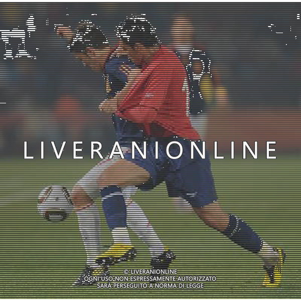 (100626) -- TSHWANE, June 26, 2010 -- David Villa (L) of Spain vies with a player of Chile during the Group H last round match at 2010 FIFA World Cup, at Loftus Verfeld stadium in Tshwane, South Africa, on June 25, 2010. Spain won 2-1 and both teams are qualified for the next round. Li Ga) (fym) PHOTOSHOT-AG ALDO LIVERANI ONLY ITALY