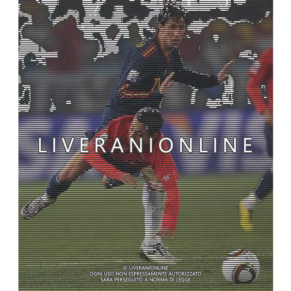 (100626) -- TSHWANE, June 26, 2010 -- Joan Capdevila (back) of Spain vies with a player of Chile during the Group H last round match at 2010 FIFA World Cup, at Loftus Verfeld stadium in Tshwane, South Africa, on June 25, 2010. Spain won 2-1 and both teams are qualified for the next round. Xing Guangli) (fym) PHOTOSHOT-AG ALDO LIVERANI ONLY ITALY