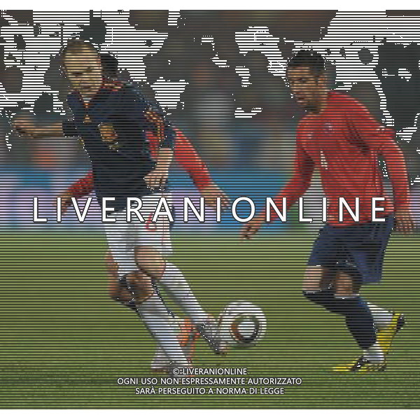 (100626) -- TSHWANE, June 26, 2010 -- Mauricio Isla (front L) of Chile vies with Andres Iniesta of Spain during the Group H last round match at 2010 FIFA World Cup, at Loftus Verfeld stadium in Tshwane, South Africa, on June 25, 2010. Guo Yong) (fym) PHOTOSHOT-AG ALDO LIVERANI ONLY ITALY