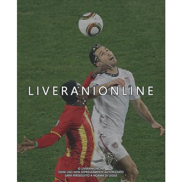 (100627) -- RUSTENBERG, June 27, 2010 -- Carlos Bocanegra (R) of the United States fights for the ball during the 2010 World Cup round of 16 soccer match against Ghana at Royal Bafokeng Stadium in Rustenburg, South Africa, on June 26, 2010. Xing Guangli) (fym)