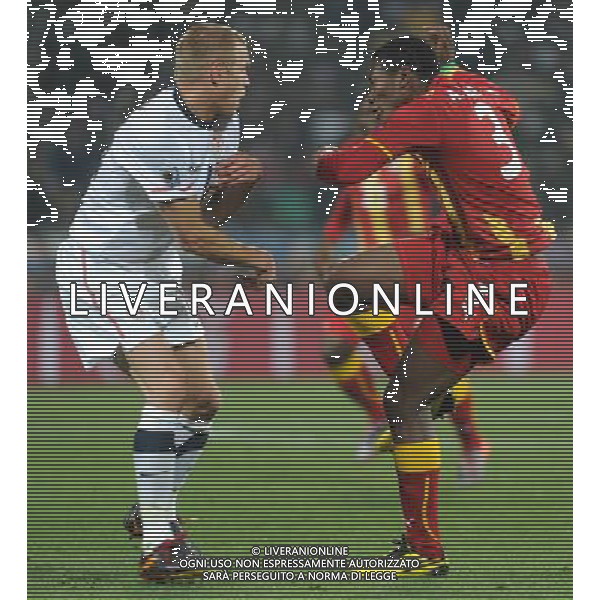 (100627) -- RUSTENBERG, June 27, 2010 -- Asamoah Gyan (R) of Ghana vies with a player of the United States during their 2010 World Cup round of 16 soccer match at Royal Bafokeng Stadium in Rustenburg, South Africa, on June 26, 2010. Li Ga) (fym)