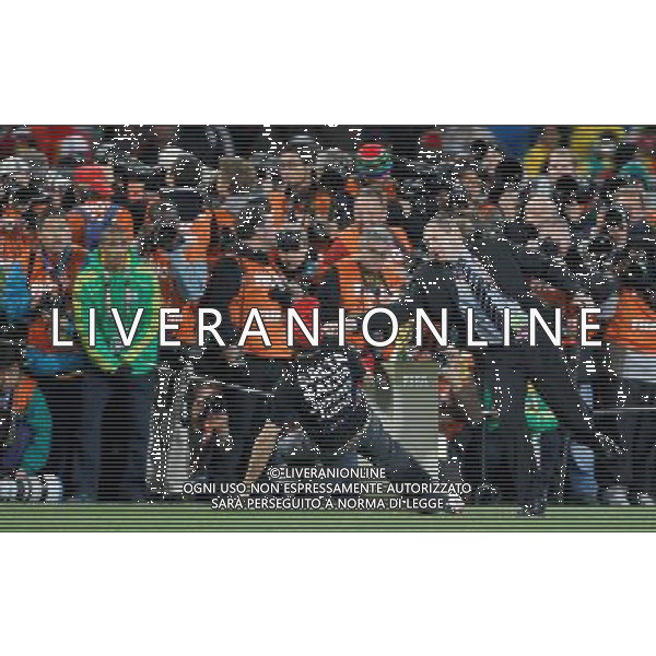 (100712) -- JOHANNESBURG, July 12, 2010 () -- A security man (R) knocks down a fan attempting to fetch the trophy before the World Cup final between the Netherlands and Spain at Soccer City stadium in Johannesburg, South Africa, July 11, 2010. (/Liao Yujie) ©Photoshot/Agenzia Aldo Liverani Sas - ITALY ONLY: OLANDA - SPAGNA FINALE FIFA WORLD CUP CAMPIONATI MONDIALI SUD AFRICA 2010