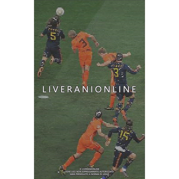 (100712) -- JOHANNESBURG, July 12, 2010 () -- John Heitinga (L2) of the Netherlands and Carles Puyol (L) of Spain vie for the ball during the World Cup final at Soccer City stadium in Johannesburg, South Africa, July 11, 2010. (/Xu Suhui) ©Photoshot/Agenzia Aldo Liverani Sas - ITALY ONLY: OLANDA - SPAGNA FINALE FIFA WORLD CUP CAMPIONATI MONDIALI SUD AFRICA 2010