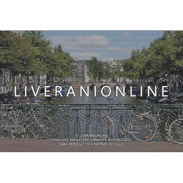 Bicycles on a bridge over a canal in Amsterdam, Holland ©PHOTOSHOT/Agenzia Aldo Liverani Sas - ITALY ONLY - VEDUTE DELLA CITTA\' DI AMSTERDAM IN OLANDA PAESI BASSI