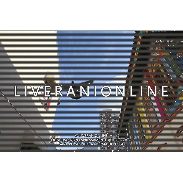 (100813) -- SINGAPORE, Aug. 13, 2010 () -- A dove flies over an Indian temple in Little India district, Singapore, Aug. 12, 2010. Little India, as the name promises, is the center for the large Indian community in Singapore. Indian temples, colorful sarees, jasmine garlands, as well as the smells of spice and blasts of Bollywood music make this district a distinct place to visit in Singapore. (/Cai Yang) (msq) ©photoshot/Agenzia Aldo Liverani Sas - ITALY ONLY - Il quartiere di Little India a Singapore, Little India, e\' il centro per la numerosa comunita\' indiana, templi indiani, saree colorati, ghirlande di gelsomini, cosi\' come gli odori di spezie e raffiche di musica di Bollywood fanno di questo quartiere un luogo da visitare