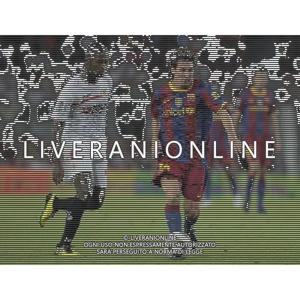 FC Barcelona\'s Lionel Messi (r) and Sevilla\'s Christian Ndri Romaric during SuperCup of Spain Final match. August 21,2010. (ALTERPHOTOS/Acero) BARCELLONA-SIVIGLIA SUPERCOPPA DI SPAGNA 2010 AG ALDO LIVERANI SAS ITALY ONLY *** Local Caption *** .
