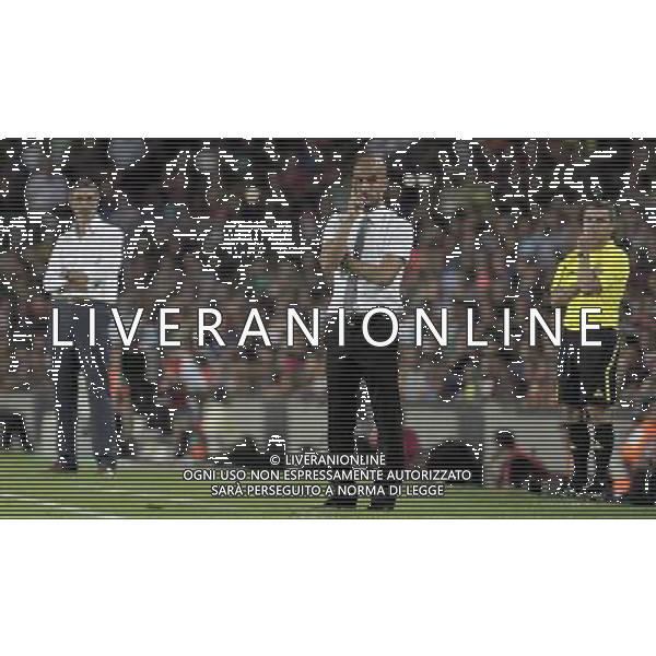 FC Barcelona\'s coach Pep Guardiola, Sevilla\'s coach Antonio Alvarez (l) and the 4th referee during SuperCup of Spain Final match. August 21,2010. (ALTERPHOTOS/Acero) BARCELLONA-SIVIGLIA SUPERCOPPA DI SPAGNA 2010 AG ALDO LIVERANI SAS ITALY ONLY *** Local Caption *** .