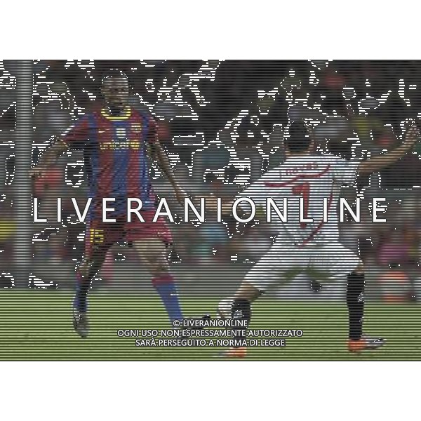 FC Barcelona\'s Seydou Keita (l) and Sevilla\'s Jesus Navas during SuperCup of Spain Final match. August 21,2010. (ALTERPHOTOS/Acero) BARCELLONA-SIVIGLIA SUPERCOPPA DI SPAGNA 2010 AG ALDO LIVERANI SAS ITALY ONLY *** Local Caption *** .