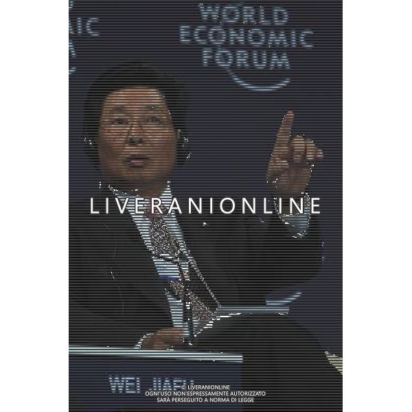(100914) -- TIANJIN, Sept. 14, 2010 -- Wei Jiafu, group president and chief executive officer of China Ocean Shipping Group Co., makes a gesture while attending the plenary session on \'Rethinking the Corporation in the 21st Century\' of the World Economic Forum (WEF) Annual Meeting of the New Champions 2010, at Tianjin Meijiang Convention Center, in north China\'s Tianjin Municipality on Sept. 14, 2010. Li Mingfang)(axy) ©PHOTOSHOT/Agenzia Aldo Liverani Sas - ITALY ONLY - EDITORIAL USE ONLY -