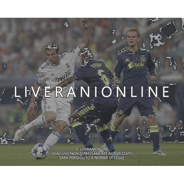 MADRID (15/(09/2010).- Champions League match Real Madrid vs Ajax Amsterdam. Gonzalo Higuain and Eyong Enoh. Photo: Cesar Cebolla / ALFAQUI - AG. ALDO LIVERANI SAS ITALY ONLY REAL MADRID vs AJAX - CHAMPIONS LEAGUE 2010-2011
