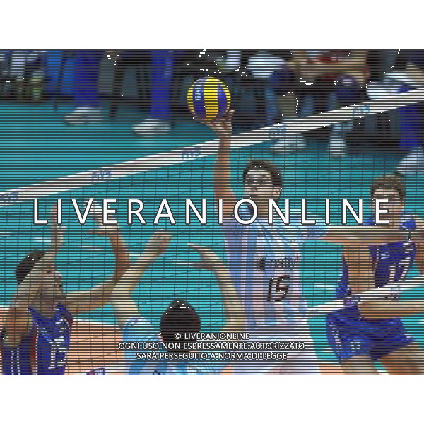 (101007) -- FLORENCE, Oct. 7, 2010 () -- Luciano De Cecco (2nd R) of Argentina drops shot the ball during the third round match against Russia at the 2010 FIVB Men\'s Volleyball World Championship in Florence, Italy, Oct. 6, 2010. Russia won 3-0. (/Chen Haitong) - Xinhua - Photoshot - Ag. Aldo Liverani sas ITALY ONLY Argentina vs Russia terzo turno Volley FIVB 2010 Campionati del Mondo di pallavolo maschile a Firenze