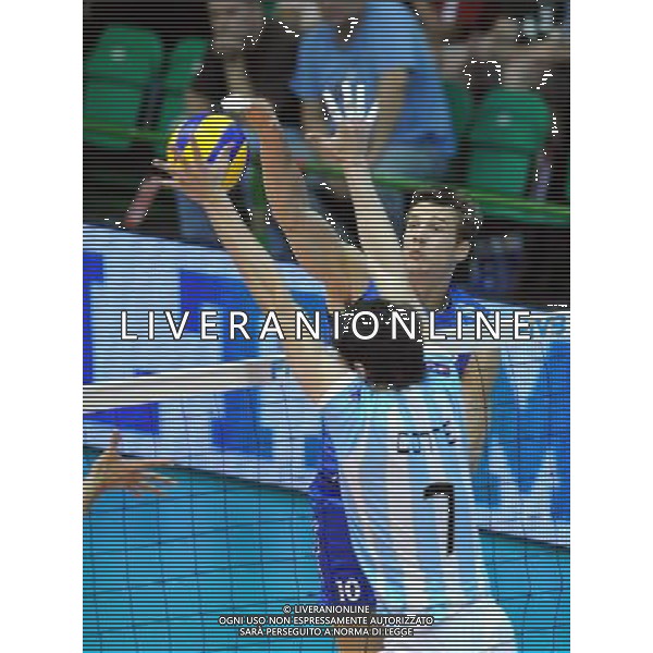 (101007) -- FLORENCE, Oct. 7, 2010 () -- Yury Berezhko (R) of Russia spikes the ball during the third round match against Argentina at the 2010 FIVB Men\'s Volleyball World Championship in Florence, Italy, Oct. 6, 2010. Russia won 3-0. (/Chen Haitong) - Xinhua - Photoshot - Ag. Aldo Liverani sas ITALY ONLY Argentina vs Russia terzo turno Volley FIVB 2010 Campionati del Mondo di pallavolo maschile a Firenze
