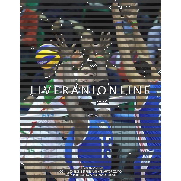 (101007) -- FLORENCE, Oct. 7, 2010 () -- Todor Aleksiev (L) of Bulgaria spikes the ball during the third round match against Cuba at the 2010 FIVB Men\'s Volleyball World Championship in Florence, Italy, Oct. 6, 2010. Cuba won 3-2. (/Chen Haitong) - XINHUA - PHOTOSHOT - AG. ALDO LIVERANI SAS ITALY ONLY Bulgaria vs Cuba terzo turno Volley FIVB 2010 Campionati del Mondo di pallavolo maschile a Firenze