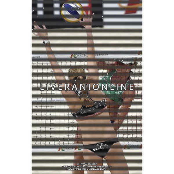 (101028) -- SANYA, Oct. 28, 2010 -- Italy\'s Valeria Rosso (R) spikes the ball in a match against the United States during the 2010 Swatch FIVB Beach Volleyball World Tour in Sanya, south China\'s Hainan Province, Oct. 28, 2010. The United States won the match 2-0. Hou Jiansen) ©PHOTOSHOT/Agenzia Aldo Liverani Sas - ITALY ONLY - 2010 Swatch FIVB Beach Volley World Tour a Sanya, nel sud della Cina 28 ottobre 2010