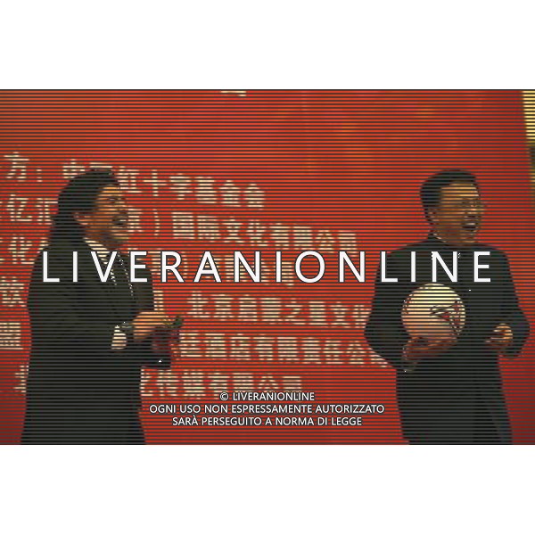 (101104) -- BEIJING, Nov. 4, 2010 -- Argentina\'s soccer legend Diego Maradona (L) reacts during an official function for the Chinese Red Cross Foundation in Beijing, capital fo China, on Nov. 4, 2010. Maradona is visiting China to play in two charity soccer matches to raise money for the foundation Cui Xinyu) (zc) - Xinhua - Photoshot - Ag. Aldo Liverani sas ITALY ONLY PECHINO - DIEGO ARMANDO MARADONA IN CINA PER UNA SERIE DI EVENTI BENEFICI ORGANIZZATI DALLA CROCE ROSSA CINESE