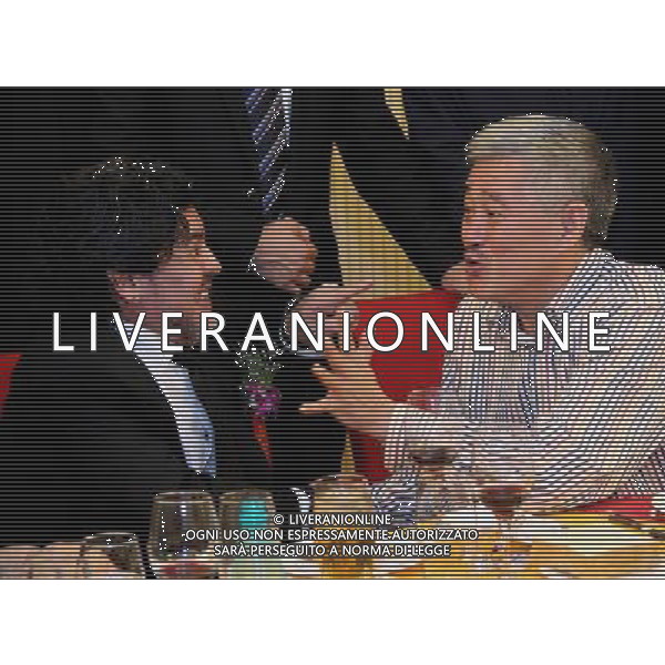 (101105) -- BEIJING, Nov. 5, 2010 () -- World soccer icon Diego Maradona (L) chats with Zhao Benshan, a famous Chinese comedian, in a charity banquet held in Beijing, capital of China, Nov. 4, 2010. Maradona, called \'King of Soccer\', by Chinese media, arrived in China on Wednesday for a series of charity events organised by the Chinese Red Cross Foundation. He will play in two fundraising matches for the foundation. (/Wang Yongji) (ljh) - Xinhua - Photoshot - Ag. Aldo Liverani sas ITALY ONLY PECHINO - DIEGO ARMANDO MARADONA IN CINA PER UNA SERIE DI EVENTI BENEFICI ORGANIZZATI DALLA CROCE ROSSA CINESE