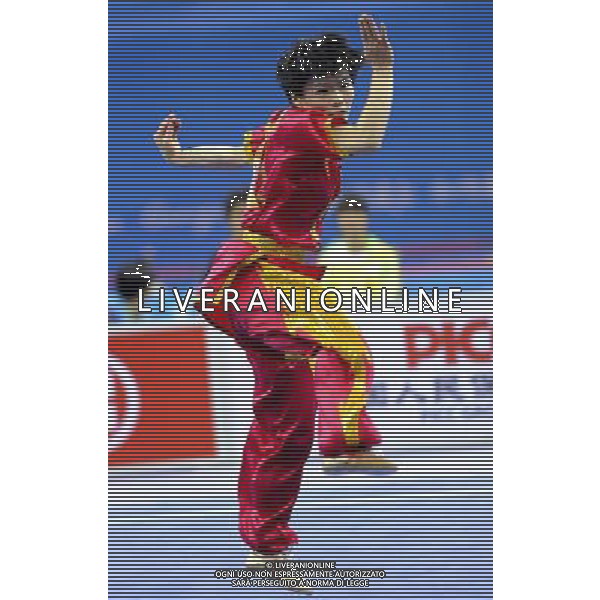 (101116) -- GUANGZHOU, Nov. 16, 2010 () --Geng Xiaoling of Hong Kong of China competes during the final of women\'s Changquan of Wushu event at the 16th Asian Games in Guangzhou, south China\'s Guangdong Province, Nov. 16, 2010. Geng won the gold medal with 9.75 points. (/Gesang Dawa)(rzl) ©photoshot/Agenzia Aldo Liverani Sas - ITALY ONLY - 16a Giochi Asiatici di Guangzhou, nel sud della Cina