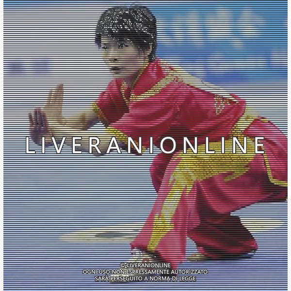 (101116) -- GUANGZHOU, Nov. 16, 2010 () --Geng Xiaoling of Hong Kong of China competes during the final of women\'s Changquan of Wushu event at the 16th Asian Games in Guangzhou, south China\'s Guangdong Province, Nov. 16, 2010. Geng won the gold medal with 9.75 points. (/Gesang Dawa)(rzl) ©photoshot/Agenzia Aldo Liverani Sas - ITALY ONLY - 16a Giochi Asiatici di Guangzhou, nel sud della Cina