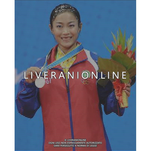(101116) -- GUANGZHOU, Nov. 16, 2010 () -- Silver medalist Oo Sandi Oo of Mynamar shows her medal during the awarding ceremony for women\'s Changquan of Wushu event at the 16th Asian Games in Guangzhou, south China\'s Guangdong Province, Nov. 16, 2010. (/Gesang Dawa)(wll) ©photoshot/Agenzia Aldo Liverani Sas - ITALY ONLY - 16a Giochi Asiatici di Guangzhou, nel sud della Cina