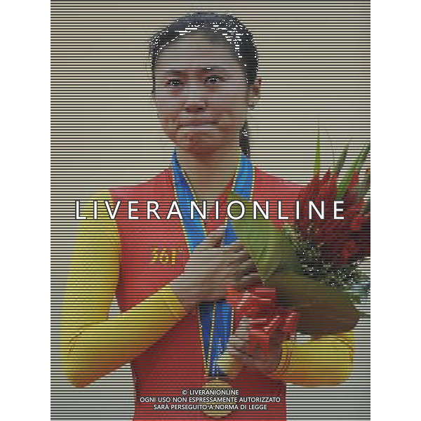 (101116) -- GUANGZHOU, Nov. 16, 2010 () -- Liu Xin of China sheds tears during the awarding ceremony for the women\'s cycling Points Race finals at the 16th Asian Games in Guangzhou, south China\'s Guangdong Province, Nov. 16, 2010. Liu won the gold medal with 34 points. (/Li Ga) ©photoshot/Agenzia Aldo Liverani Sas - ITALY ONLY - 16a Giochi Asiatici di Guangzhou, nel sud della Cina