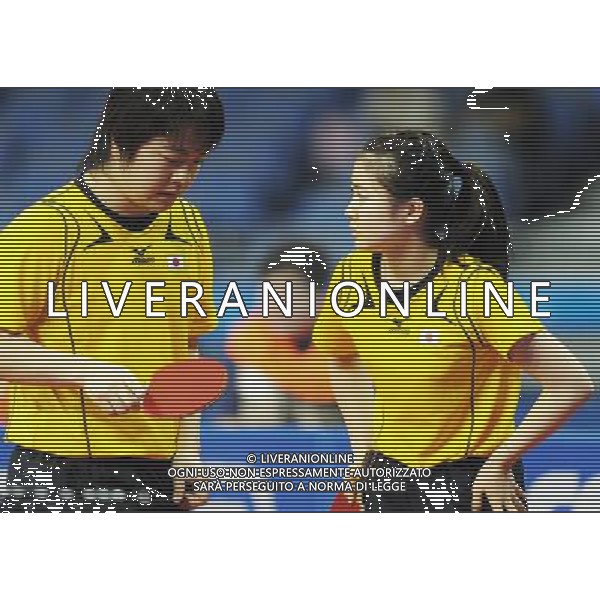 (101116) -- GUANGZHOU, Nov. 16, 2010 () -- Japan\'s Kishikawa Seiya and Fukuhara Ai (R) talk during their mixed doubles 1/8 final of table tennis against India\'s Sharath Achanta/Shamini at the 16th Asian Games held in Guangzhou, capital of south China\'s Guangdong Province, Nov. 16, 2010. The Japanese pair won by 3-2. (/Xu Jiajun) ©photoshot/Agenzia Aldo Liverani Sas - ITALY ONLY - 16a Giochi Asiatici di Guangzhou, nel sud della Cina